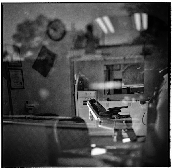 Empty Chair Through Window Baca St Santa Fe